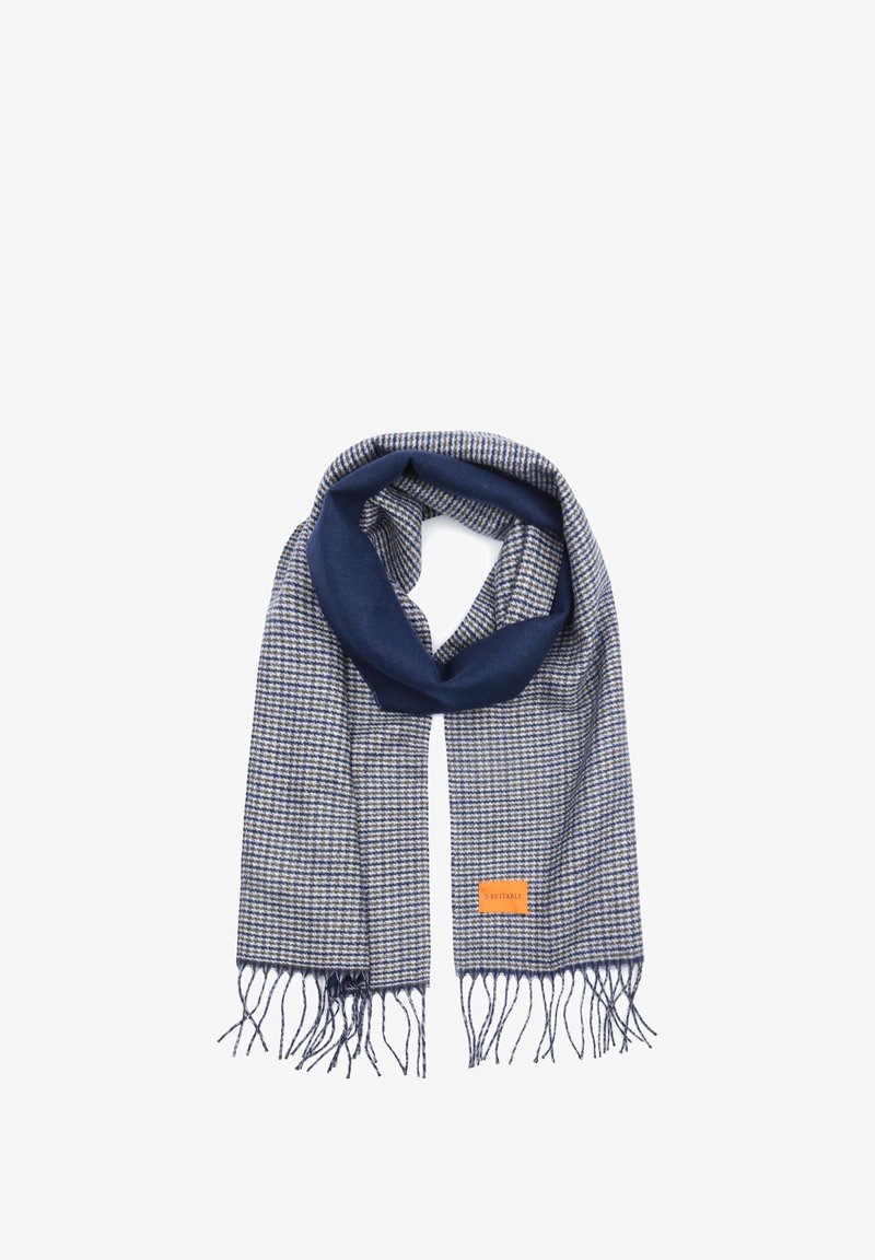Navy and beige checkered scarf with fringed edges; features a smooth texture and an orange brand label.