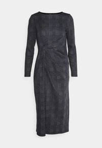 Robe ajustée à manches longues de coloris gris foncé avec un motif à carreaux, dotée d'un détail twist à la taille et d'une longueur en dessous du genou.