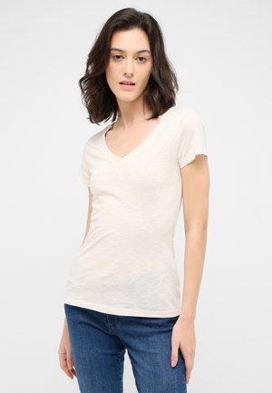 Light beige cotton t-shirt with a v-neck, short sleeves, and a fitted design. The fabric has a slightly textured appearance.