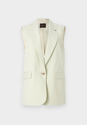 Krémový prúžkovaný blejzer bez rukávov s výrezmi na golieri, dvoma náprsníkmi s klopami a jedným hnedým zapínaním na gombík.