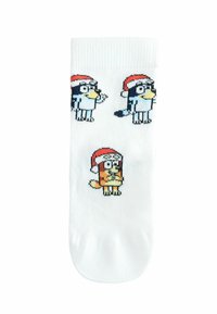 White socks featuring cartoon animal designs wearing red and white Santa hats, with one blue bird and one orange animal holding a present.