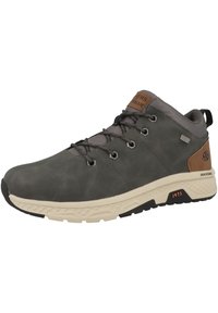 Chaussure de randonnée en cuir gris foncé avec des accents en maille grise, semelle beige, œillets en métal et une pièce de logo marron près de la cheville. Motif de semelle proéminent.