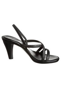 Sandales à talons noires avec plusieurs fines lanières à texture pailletée, design à bout ouvert, et talon incurvé pour plus de hauteur.