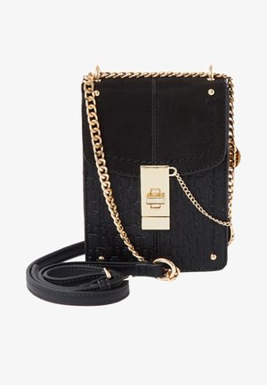 Black crossbody bag made of textured material, featuring a gold clasp and chain strap. Rectangular shape with a flap closure and small studs.