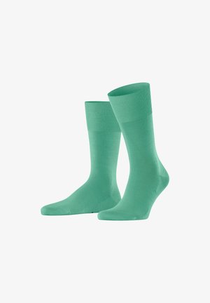 Mintgrüne Socken aus weichem Baumwoll-Mix, mit einem gerippten Bündchen und glatter Textur, im Design einer mittellangen Variante bis zur Wade.