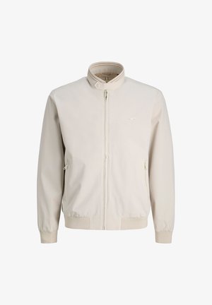 Ελαφριά μπεζ μπουφάν τύπου bomber με όρθιο γιακά, μπροστινό φερμουάρ και πλαϊνές τσέπες με φερμουάρ. Διαθέτει απαλή υφή υφάσματος και ριμπ μανσέτες.