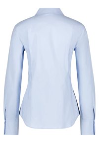 Light blue button-up shirt, long sleeves, pointed collar, tailored fit, front yoke seam, side slits, smooth cotton fabric.