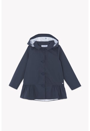 Manteau à capuche pour enfants de couleur bleu marine foncé, fermé par des boutons, avec un ourlet à volants et une doublure intérieure à motifs floraux clairs dans la capuche.