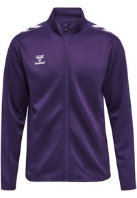 Giacca sportiva viola con colletto alto, zip frontale completa e accenti a chevron bianchi sulle spalle. Realizzata in tessuto liscio e leggero.