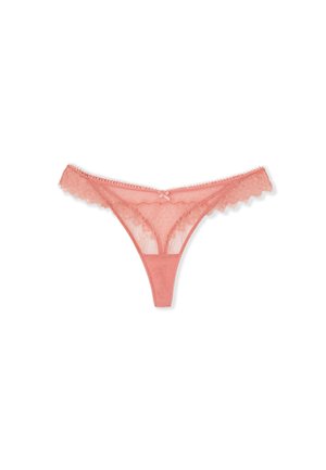 G-string in pizzo corallo con bordi scallopati, un piccolo fiocco al centro e dettagli in tessuto a rete trasparente con pois.