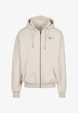 Light beige zip-up hoodie made of soft fabric, featuring a hood, two front pockets, ribbed cuffs, and an embroidered logo on the chest.