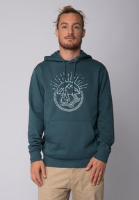 Türkiser Kapuzenpullover mit einer Vordertasche, featuring ein wei�ßes Grafikdesign von Bergen und Bäumen. Hergestellt aus weichem Stoff mit einer lässigen Passform und Kordelzug-Kapuze.