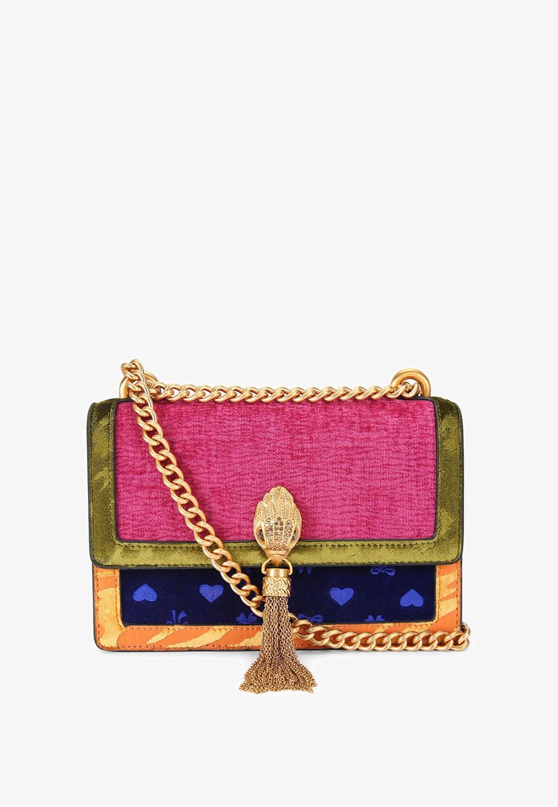 Colorful handbag with a velvet pink top flap, green base, gold chain strap, and textured accents. Features a decorative tassel and heart patterns.