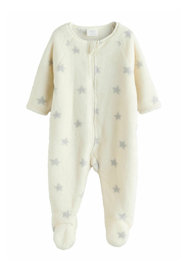 Crème-kleurige fleece babyonesie met grijze sterpatronen, lange mouwen, ritssluiting en voetjes. Zachte textuur en ronde kraag.