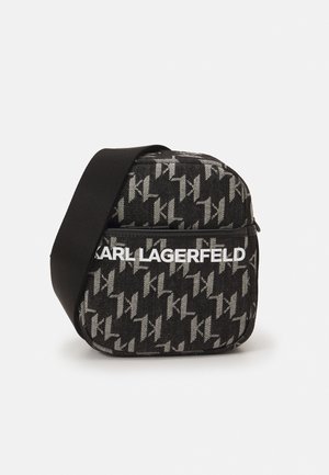 Black and gray crossbody bag with repeating "KL" pattern and white "KARL LAGERFELD" text across the front pocket, wide black strap.