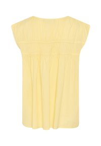 Haut en coton jaune avec des manches courtes et larges, présentant une texture froncée au niveau de la poitrine et une silhouette décontractée et fluide.