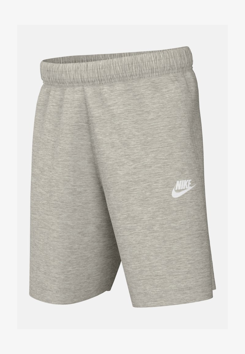 Hallid hallid spordilühikesed püksid tekstureeritud kangast, millel on elastne vöökoht ja valge Nike logo vasakul pooled.