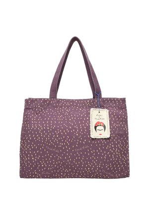Lila Leinen-Shopper mit einem gepunkteten Muster, ausgestattet mit zwei Griffen und einem Anhänger, der eine stilisierte Illustration und den Text "Frida Kahlo" zeigt.