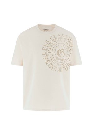 Tricou din bumbac crem, cu un logo mare, bej, reliefat, cu un design circular, având textul "Guess Classic" și "Los Angeles". Mâneci scurte.