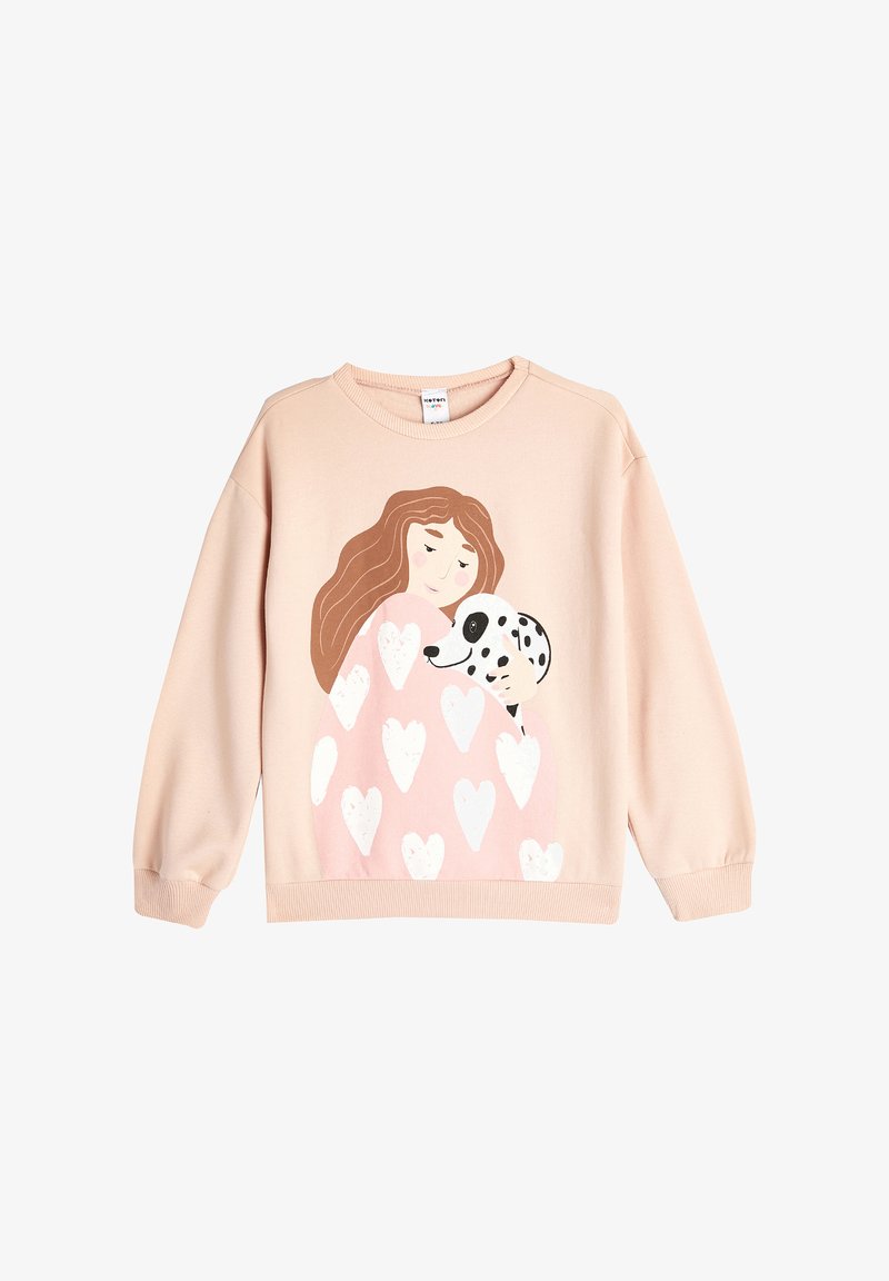 Felpa rosa con colletto arrotondato, presenta un design di una ragazza che tiene un dalmata. Modelli a cuore sono ben visibili sulla parte anteriore. Tessuto morbido.