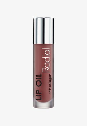 Lip oil in a frosted glass container, with a metallic silver cap. Features black text: "LIP OIL" and "Rodial" on a mauve background.