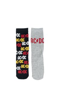 Calzini a tema AC/DC; uno nero con loghi e motivi a zig zag rossi, gialli e bianchi, e uno grigio con loghi rossi. Materiale in cotone misto.