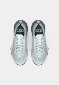 Pair of white and gray Nike Air Max sneakers with mesh fabric and laces, viewed from above on a plain white background.