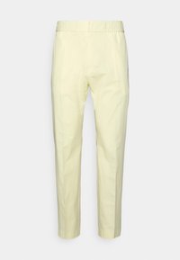 Ljust gula tapered byxor med elastisk midja, som har rena linjer och en slät yta, designade för en avslappnad passform.