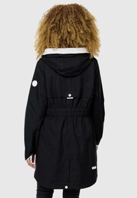 Black hooded jacket with an elastic waist, white accents, a textured fabric, and snap closures on the back and sleeves.