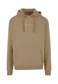 Beige mikina s klokaní kapsou vpředu, nastavovací kapucí a bílým logem na hrudi. Vyrobena z měkkého materiálu s uvolněným střihem.