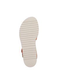 Suola in gomma bianca con texture rigata, caratterizzata da una forma arrotondata e un logo impressa vicino al tallone. Parte superiore arancione non visibile.