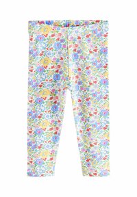 Gyermek leggings sűrű virágmintával, pasztell sárgában, kékben, rózsaszínben és pirosban, fehér háttérrel.