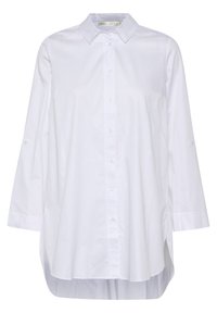 Balta krekla ar pogām izgatavota no kokvilnas, ar apkakli, garām piedurknēm un izliekts apakšmalu ar sānu šķēlumiem. Gluda tekstūra un klasiskā dizaina.