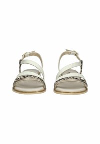 White leather sandals with cross straps, animal print accents, flat soles, and ankle buckle closures.