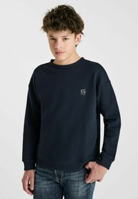 Marineblauwe sweatshirt met een ronde hals en geribbelde manchetten. Voorzien van een klein logo op de borst. Zachte textuur, casual pasvorm.