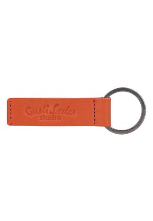 Leather keychain with embossed "Gusti Leder studio" text and a metal keyring attached to one end.