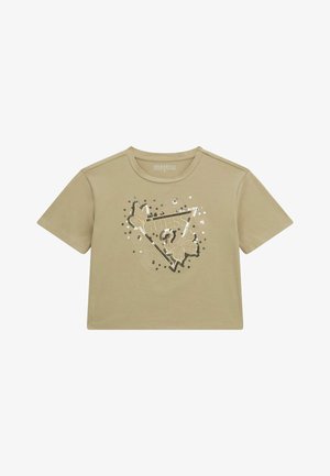 Heledad beež värvi lühikeste varrukatega T-särk, millel on kolmnurga kujutisega kaunistus, pandud sädeleva ja lehe detailiga, ümmargune kaelus ning lõdvem istuvus.