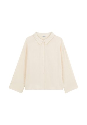 Chemise légère de couleur crème avec une patte de boutonnage sur le devant, un col large et des manches longues. Présente un tissu texturé avec des rayures verticales subtiles.