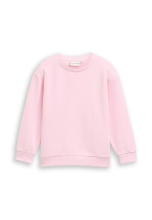 Sweat-shirt rose clair à manches longues avec col rond, poignets et bas côtelés, avec un petit détail en forme de cœur sur le haut gauche de la poitrine.