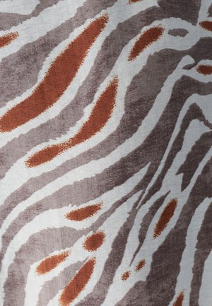Fabric featuring an abstract animal print with wavy stripes in shades of brown, rust, and cream. Texture appears smooth with a matte finish.