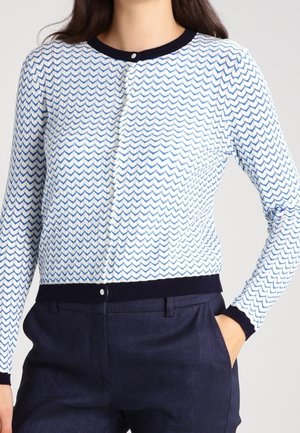 Cardigan lavorato a maglia con motivo a zigzag in blu e bianco, con colletto e polsini a coste in blu navy e chiusura con bottoni.