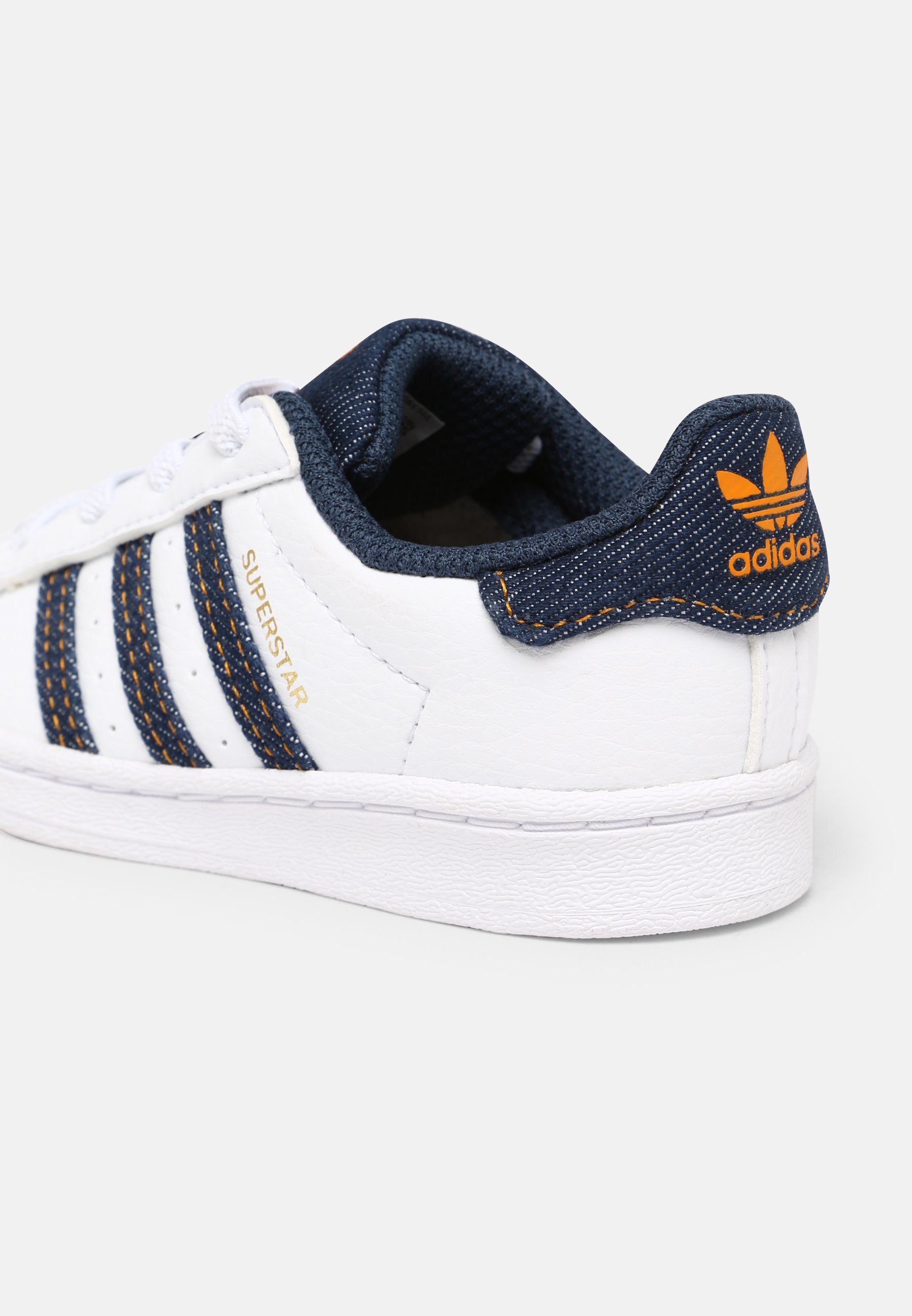 white and navy shell toe adidas