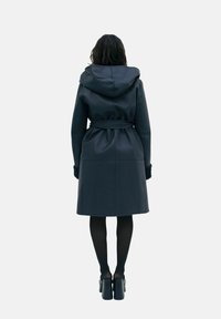 Black hooded coat with a belted waist, made of smooth material, featuring a mid-length design and long sleeves.