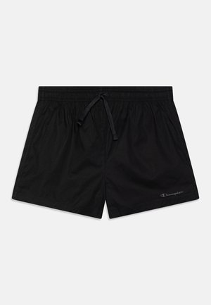Sorte svømme-shorts med elastisk taljebånd og snor, med et lille Champion-logo på det nederste højre ben.