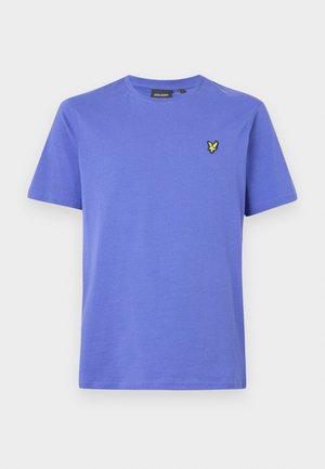 Rövid ujjú világoslila pamut póló, kerek nyakkivágással és egy kis sárga hímzett logóval a bal mellrészen.