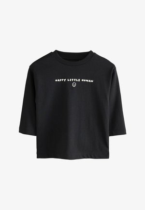 Tricou negru cu mânecă scurtă, cu text alb "HAPPY LITTLE HUMAN" și un mic zâmbet sub text în partea din față.