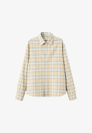 Košulja s dugim rukavima na kockice u pastelnom žutom s plavim i bijelim kvadratima. Zatvara se na gumbe sprijeda, ima ovratnik i opušteni kroj. Mekana tekstura tkanine.