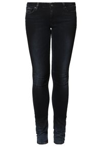 Jean skinny noir en denim, avec une texture lisse, un design à cinq poches et des détails de couture pour une silhouette ajustée.