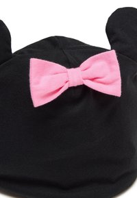 Black beanie with two rounded ears, featuring a pink fabric bow at the back. Made of soft knit material with a smooth texture.