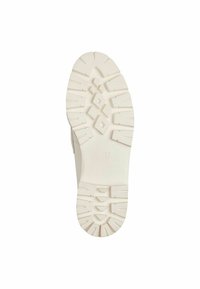 Soletta in gomma bianca con motivo di presa testurizzato, caratterizzata da tacchi profondi e una marcatura di dimensione "37" scolpita nella base.